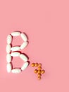 Vitamin B7 is laid out in tablets. biotin, vitamin H, coenzyme. Photo top view. pink.