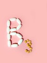 Vitamin B3 is laid out in tablets. niacin, nicotinic acid, PP. Photo top view. pink.