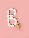 Vitamin B1 is laid out in tablets. thiamine Photo top view. pink.