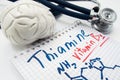 Vitamin B1 Thiamin concept photo. Stethoscope and brain figure lies next to inscription Vitamin B1 thiamin and vitamin chemical fo