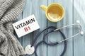 Vitamin B1 words written on label tag with medicine and stethoscope with wood background Royalty Free Stock Photo