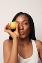 Dark skinned woman with fruits lemon. Energy from fruits, health and vitamins. Royalty Free Stock Photo