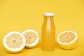 Vitamin c health remedy relief drink for cold and flu, with lemon, ginger and cinnamon spice and honey on yellow background. Royalty Free Stock Photo