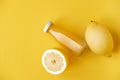 Vitamin c health remedy relief drink for cold and flu, with lemon and orange fruit, ginger and cinnamon spice and honey on yellow Royalty Free Stock Photo