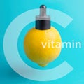 Vitamin C. lemon with cap and pipette. Essential oil, serum, or essential oil Royalty Free Stock Photo