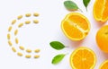 Vitamin C pills with  fresh orange citrus fruit isolated on white Royalty Free Stock Photo