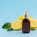 Vitamin C serum, citrus fruit essential oil. beauty care. Fresh lemons bio oil. Organic bio cosmetics with vitamin C Royalty Free Stock Photo