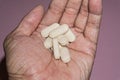 Close up picture of a man hand holding Vitamin C pills, 1000mg. Royalty Free Stock Photo