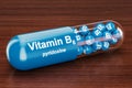 Vitamin capsule B6 on the wooden table. 3D rendering