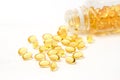 Vitamin capsules with E poured out of bottle Royalty Free Stock Photo
