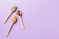 Vitamin capsules in a wooden spoon on a colored background. Pills served as a healthy meal. Drugs, pharmacy, medicine or Royalty Free Stock Photo