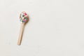 Vitamin capsules in a wooden spoon on a colored background. Pills served as a healthy meal. Drugs, pharmacy, medicine or Royalty Free Stock Photo