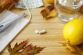 Vitamin D, vitamin C and zinc pills on table with face mask, lemons and fall leaves. Boost immune Royalty Free Stock Photo