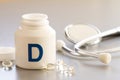 Vitamin D in capsules with stethoscope, health and immunity concept