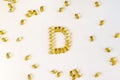 Vitamin D pills spelt out in the letter D