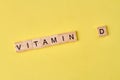 Vitamin d word written on wooden blocks.