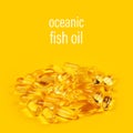 Vitamin e omega 3 fish oil yellow pills vitamins sport nutrition healthy on the yellow background isolated close up Royalty Free Stock Photo