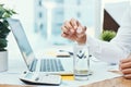 This vitamin is just what he needs. an unrecognizable businessman dissolving an effervescent tablet in a glass of water. Royalty Free Stock Photo