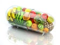 Vitamin pill capsule with fruits and vegetables. Nutrition supplemet and health eating concept