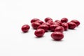 Vitamin red pills selective focus on white background Royalty Free Stock Photo