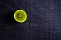 Vitamin rich Fresh Lemon piece on a dark blue background