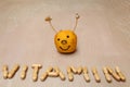 Vitamin sign created from vitamin pills in front of a smiley Royalty Free Stock Photo
