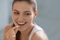 Vitamin. Smiling woman taking omega pill, fish oil supplement