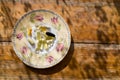 Vitamin tablets on tea plate with floral decorations