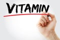 Vitamin text with marker, health concept background