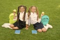 Vitamin works wonders. Happy children hold apples on green grass. School break. Vitamin snack. Choosing vitamin fruit