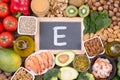 Vitamine E food sources, top view on wooden background