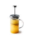 Vitaminic healthy orange coffeine free sea buckthorn tea in french press with fresh raw sea buckthorn berries