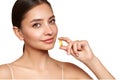 Beautiful Girl With Pill With Cod Liver Oil Omega-3 Royalty Free Stock Photo