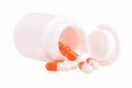 Vitamins, medicine in a white and red capsule  in bottle Royalty Free Stock Photo