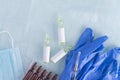 Vitamins and medicines in ampoules and medical personal protective equipment on a light background