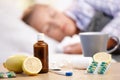 Vitamins medicines for flu woman in background Royalty Free Stock Photo