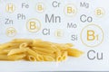 Vitamins and minerals in hard pasta. Conceptual photo with a list of useful substances in pasta. Photo for a blog about diets and