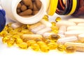 Vitamins, omega 3, cod-liver oil, dietary supplement and tablets an embankment on a light background close up Royalty Free Stock Photo