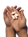 Vitamins And Supplements. Child's Hand with Medicinal Pills.