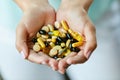 Vitamins And Supplements. Woman Hands Full Of Medication Pills Royalty Free Stock Photo