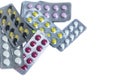 Vitamins and tablets blister pack on a white background, close-up. Royalty Free Stock Photo