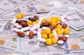 Vitamins, tablets and dietary supplements of different colors in dollars Royalty Free Stock Photo