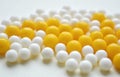 Vitamins yellow and white round beautiful texture close up background