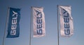 Vitebsk, Belarus - April 18, 2021: flags of the Geely dealership near the building of the official dealer of the company