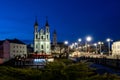 Vitebsk, Belarus. Panorama Of Evening View Church Of Resurrection Of Christ And Old Town Hall In Street Lights Illumination