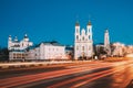 Vitebsk, Belarus. Traffic At Street And Holy Assumption Cathedral, Holy Resurrection Church And City Hall In Evening Or