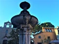 Viterbo city fountain and ancient buildings, Italy. Art and the sky