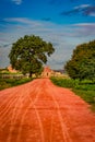 Vithala temple with leading red soil road and amazing blue sky at hampi ruins Royalty Free Stock Photo