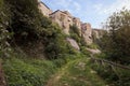 Vitorchiano, Viterbo, Lazio, Italy: trekking on the path at the base of the hill with the picturesque medieval village Royalty Free Stock Photo