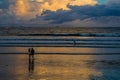 vitoria ES Brazil - Mar 17 2023: Girls friends watching the surfer on the beach